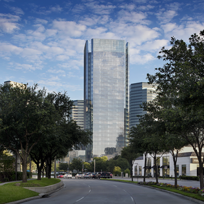 Exterior design of the office tower for BHP headquarters in Houston, Texas with adequate greenery on the road.