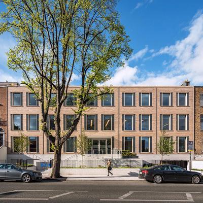 The exterior view of Eaton House located in Dublin, Ireland, designed with 1970 building’s concrete frame. 