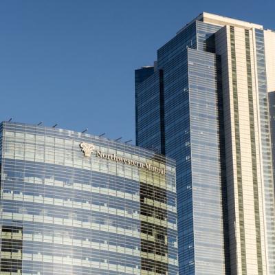 Northwestern Mutual’s North Office Tower with its modern glass facade, shown as interior renovation work begins on the landmark building.