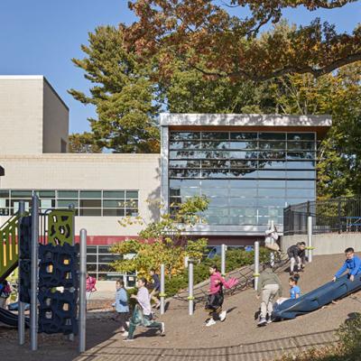 Children playing outside Barack H. Obama Magnet University school, the three-story brick-clad building New Haven, Connecticut. 